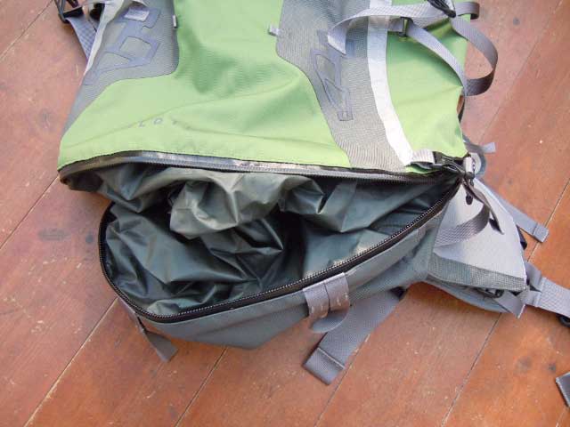 Waterproof zip into lower compartment. Note the floppy divider that can either keep wet and dry stuff separate, or be flattened into the bottom of the bag allowing 1-compartment use.